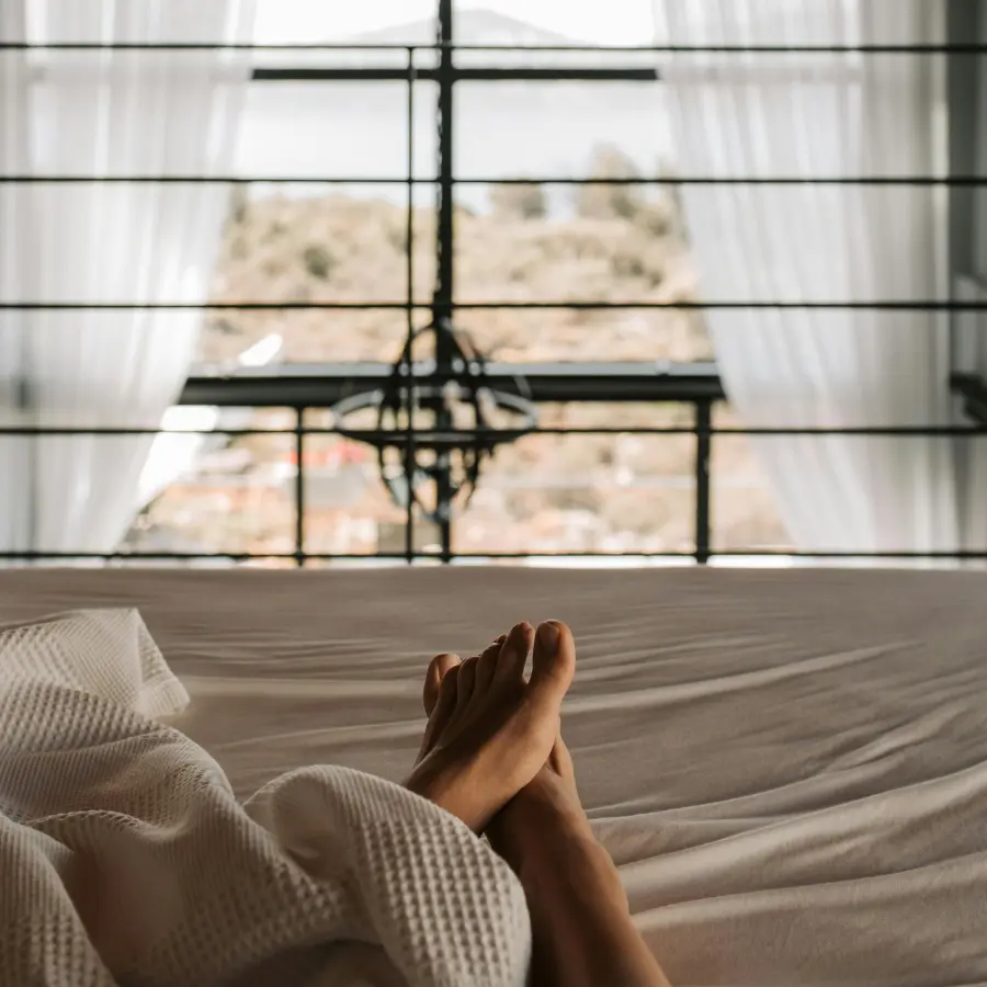 Person enjoying the light streaming through the window